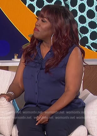 Sheryl’s navy sleeveless top on The Talk