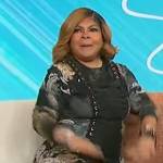 April Ryan’s black paisley print lace-up dress on Sherri