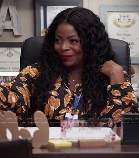 Ava’s black floral print blouse on Abbott Elementary
