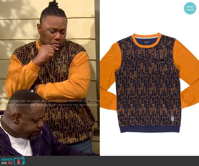 A. Tiziano Nathan Crew worn by Marty (Marcel Spears) on The Neighborhood