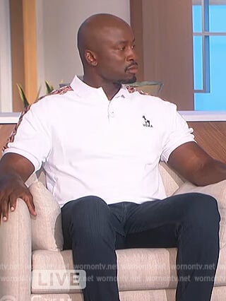 Akbar’s white printed polo shirt on The Talk