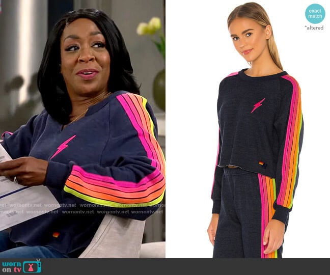Aviator Nation Bolt Sweatshirt in Heather Navy Neon worn by Tina Butler (Tichina Arnold) on The Neighborhood