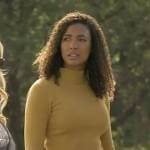 Cassie’s yellow bell-sleeve knit top on Big Sky