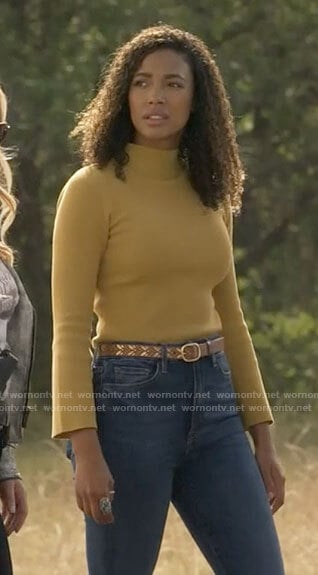Cassie’s yellow bell-sleeve knit top on Big Sky