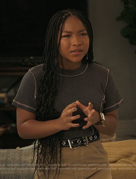 Delilah’s grey tee with pink seams, beige pants and butterfly earrings on The Equalizer