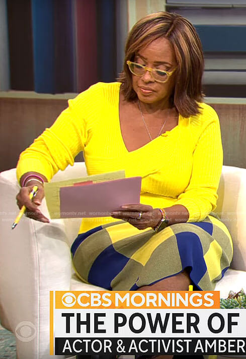 Gayle King’s yellow asymmetric sweater and blue checked skirt on CBS Mornings