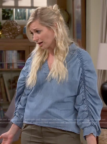Gemma’s denim ruched puff sleeve top on The Neighborhood