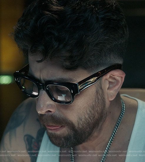 Harry’s glasses and chain on The Equalizer