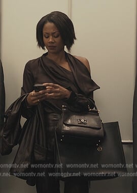 Jax’s satin one shoulder blouse on Reasonable Doubt