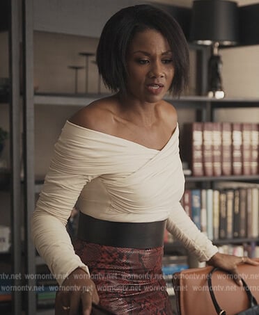 Jax’s white off shoulder wrap blouse on Reasonable Doubt