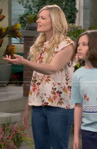 Gemma’s cream floral ruffle trim top on The Neighborhood