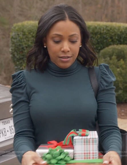 Kayla’s green puff-sleeve turtleneck top on Monarch