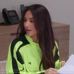 Kim’s neon yellow long sleeve top on The Kardashians
