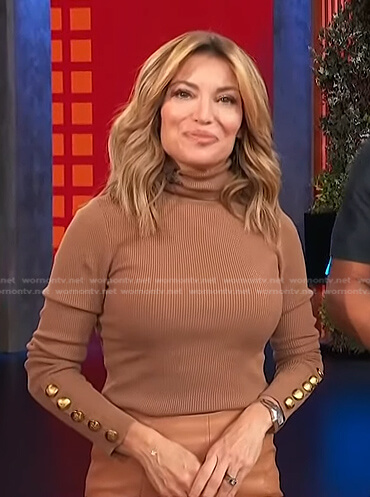 Kit’s brown button-sleeve turleneck sweater on Access Hollywood