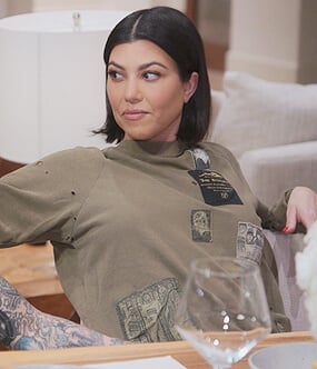 Kourtney’s khaki patch sweatshirt on The Kardashians