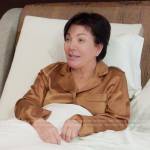 Kris’s brown satin pajama top on The Kardashians