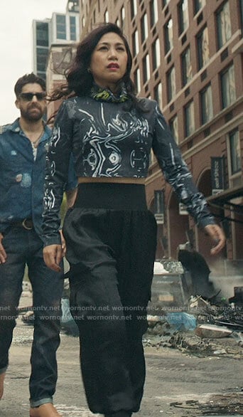 Mel’s marble print crop top and black cargo pants on The Equalizer