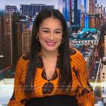 Morgan’s orange printed v-neck top on NBC News Daily