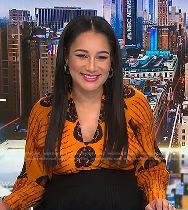 Morgan’s orange printed v-neck top on NBC News Daily