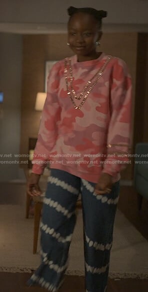 Naima’s pink camo sweatshirt and tie dye jeans on Reasonable Doubt