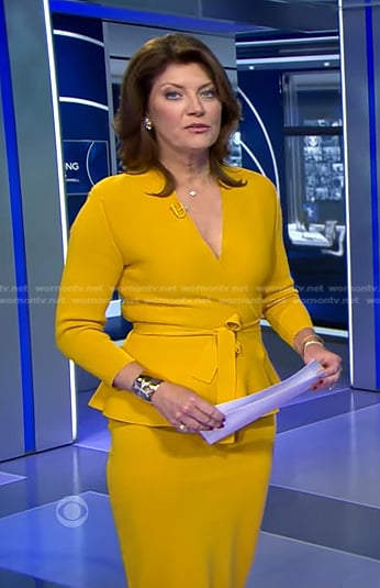 Norah’s yellow wrap peplum jacket and skirt on CBS Evening News