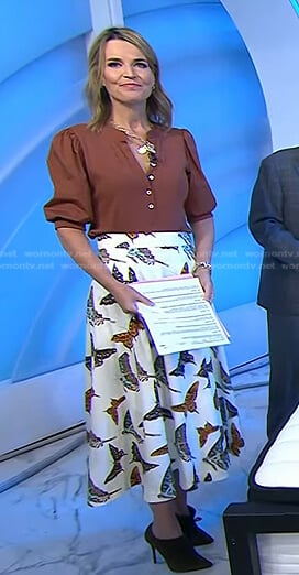 Savannah’s brown puff top and butterfly print skirt on Today