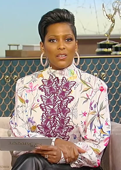 Tamron’s floral blouse with butterfly applique on Tamron Hall Show