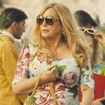 Tanya’s floral dress, sunglasses, and pink bag on The White Lotus