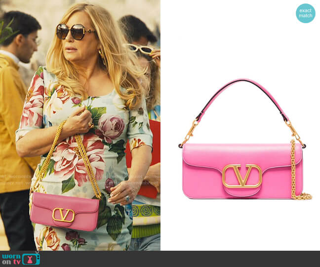 Valentino Garavani V-Logo Clutch Bag worn by Tanya McQuoid (Jennifer Coolidge) on The White Lotus