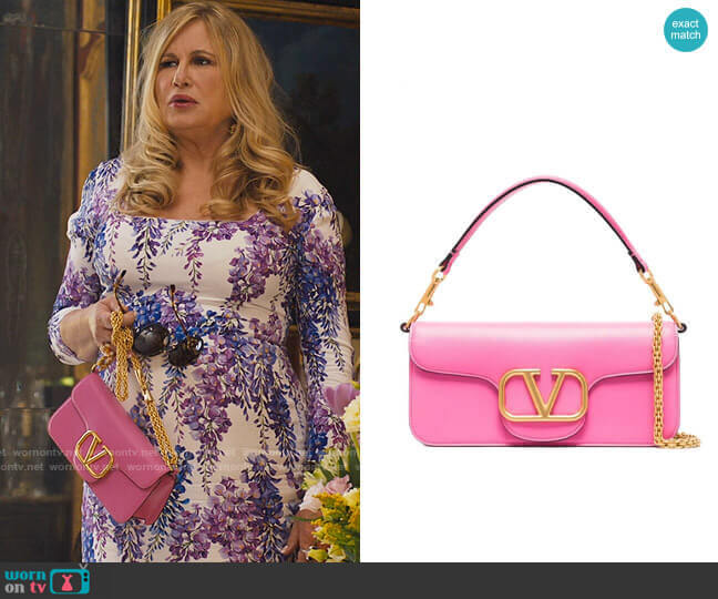 Valentino Garavani V-Logo Clutch Bag worn by Tanya McQuoid (Jennifer Coolidge) on The White Lotus