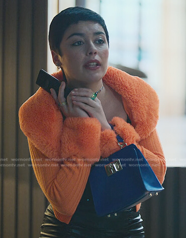 Ari’s orange shearling trim knit jacket on Elite