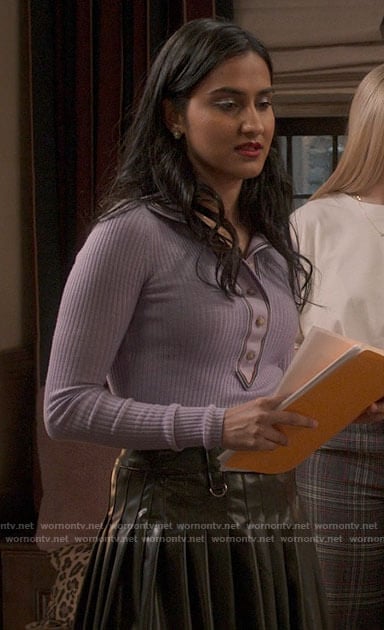 Bela’s purple polo top and pleated leather skirt on The Sex Lives of College Girls