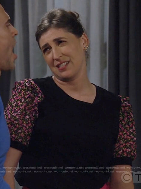 Kat’s black top with floral sleeves on Call Me Kat