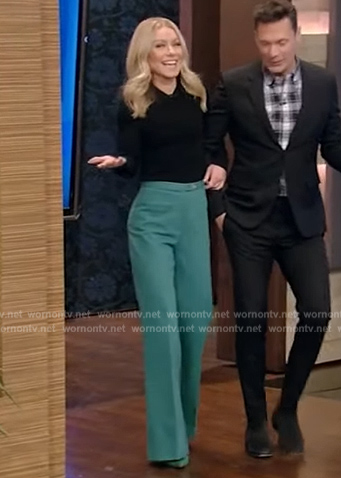 Kelly’s black blouse and green pants on Live with Kelly