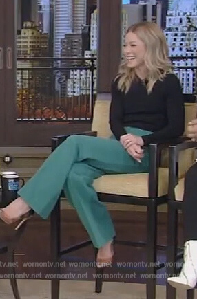 Kelly’s black blouse and green pants on Live with Kelly