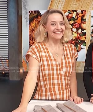 Kelsey Nixon’s orange check wrap dress on Access Hollywood