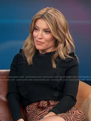 Kit’s brown tiger print mini skirt on Access Hollywood