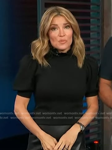 Kit’s black puff sleeve top on Access Hollywood