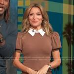 Kit’s brown puff sleeve sweater and pleated mini skirt on Access Hollywood