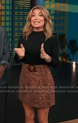 Kit’s brown tiger print mini skirt on Access Hollywood