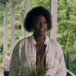 Nova’s white drawing print shirt and fanned earrings on Queen Sugar