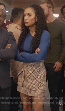 Olivia’s plaid mini skirt and blue top on All American