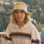 Portia’s striped polo shirt and crochet hat on The White Lotus
