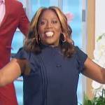 Sheryl’s navy pleated ruffle top on The Talk