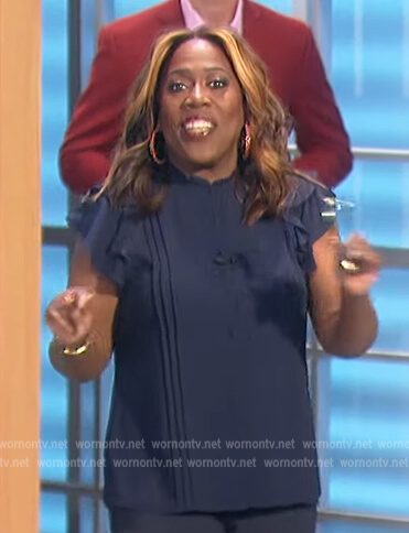 Sheryl’s navy pleated ruffle top on The Talk