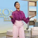 Tamron’s purple ruffle sheer blouse on Tamron Hall Show