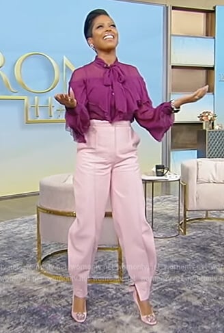 Tamron’s purple ruffle sheer blouse on Tamron Hall Show