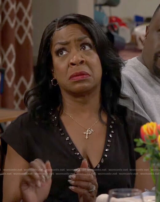 Tina’s black embellished v-neck tee on The Neighborhood
