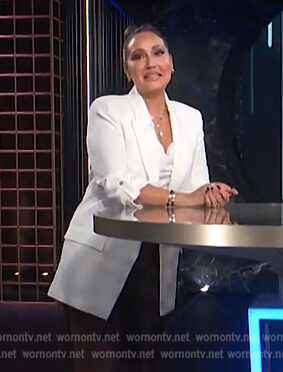 Adrienne’s white roll-up sleeve jacket on E! News