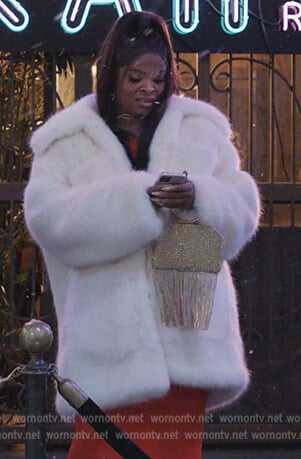 Ava’s white oversized fur coat on Abbott Elementary